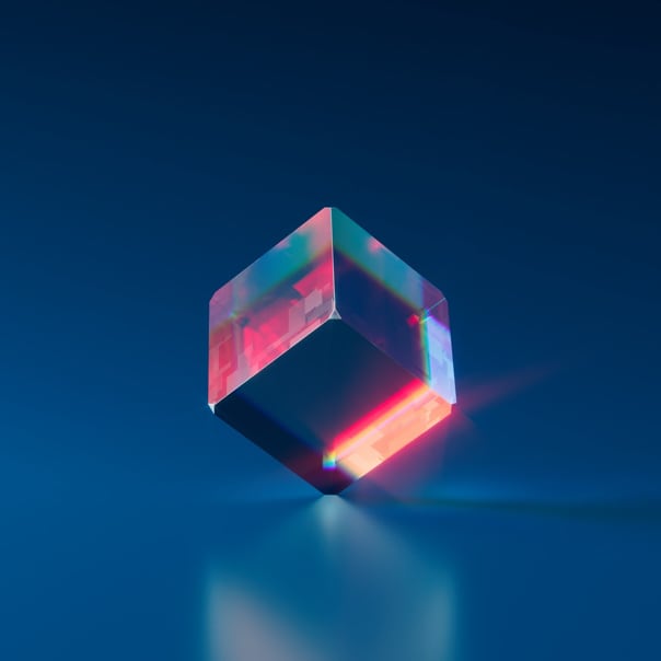 a shiny cube spinning on one of its corners